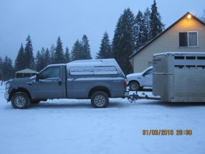 Pictures of the pickup and stocktrailer taking off on a snowy, icy morning.